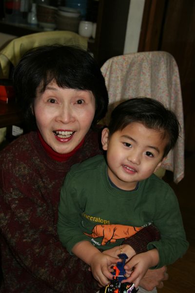 Sumiyo piggy-backed Cameron when he was 4 mos old in 2003