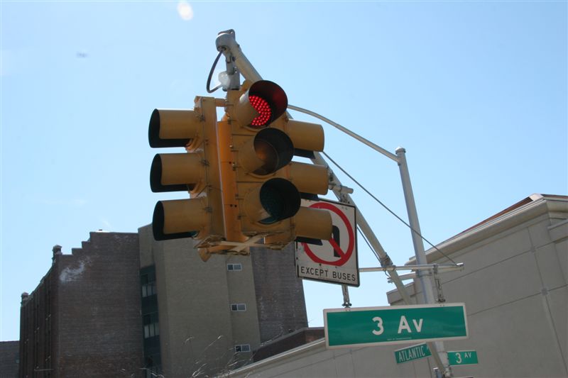 We are so close to these street lights, we could literally touch them from our bus