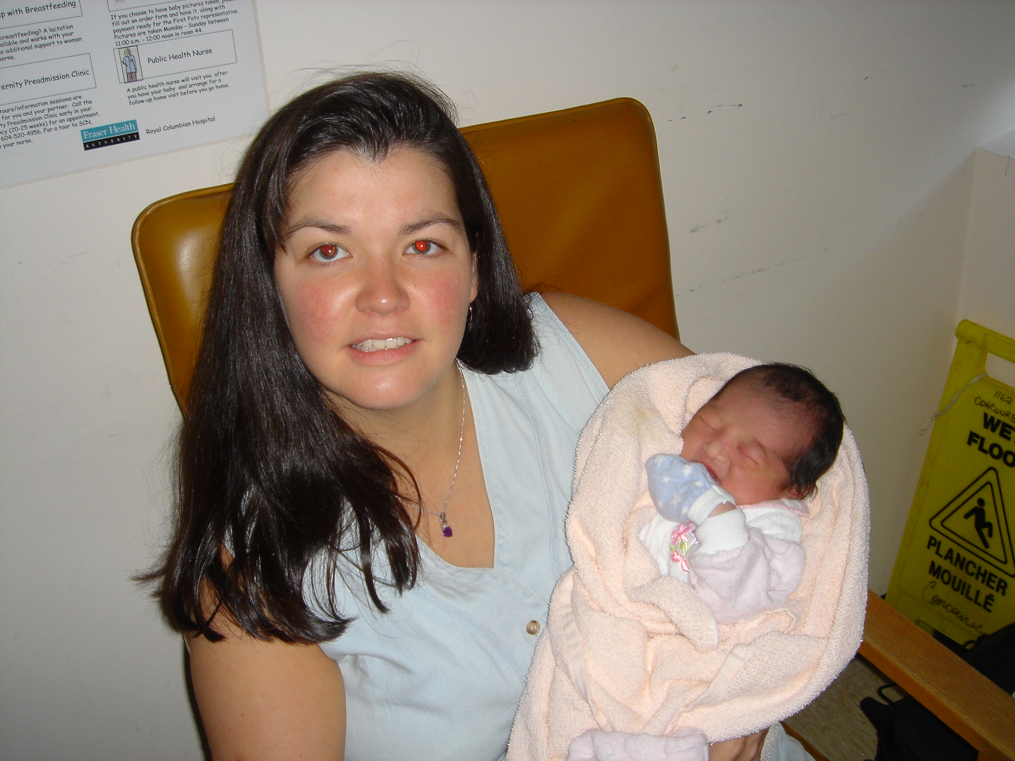 Auntie Carla holding Baby Kendra 12 hours old