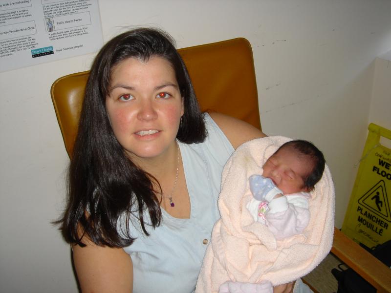 Auntie Carla holding Baby Kendra 12 hours old