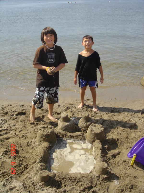 Sand Architect and engineer, Taro and Kenz flaunt thier creation.