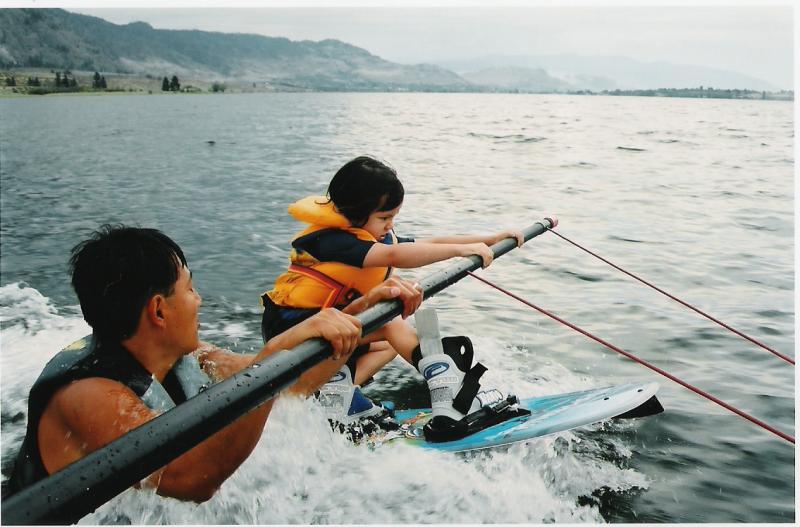 Sarah wake boarding with uncle Alex's help